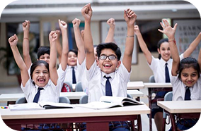 Students raising hands in classroom